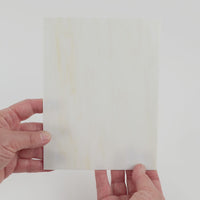 Video of the Antique Ivory glass plate in translucent beige, 15x19cm, held up and tilted to show its pattern and transparency