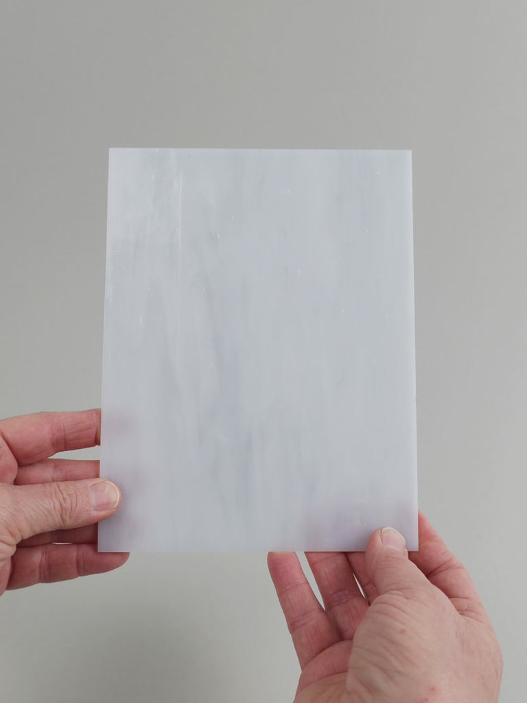 Video of the Stone glass plate in translucent grey, 15x19cm, held up and tilted to show its pattern and transparency