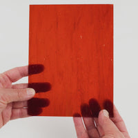 Video of the Hardwood glass plate in transparent brown, 15x19cm, held up and tilted to show its pattern and transparency