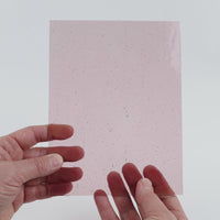 Video of the Pale Violet glass plate in transparent purple, 15x19cm, held up and tilted to show its pattern and transparency